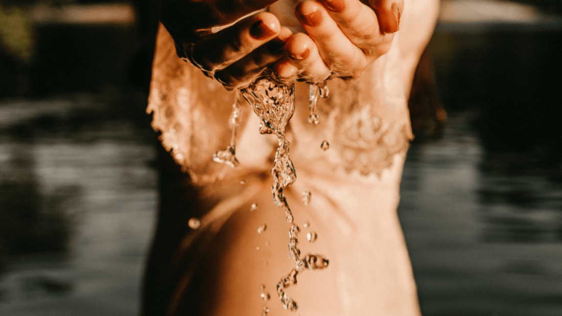 Woman with water in her hands