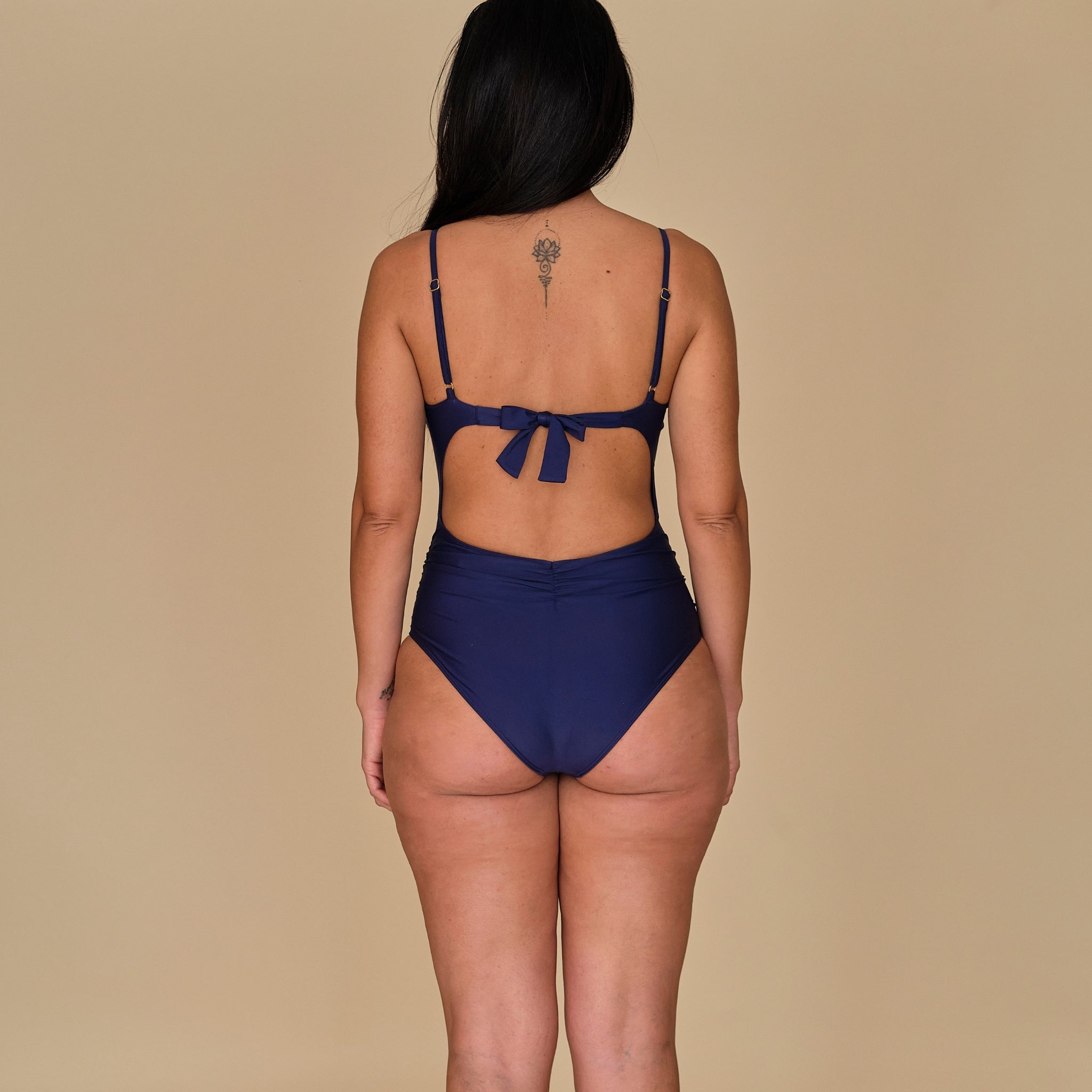 Woman in a swimsuit in navy blue made out of sustainable materials, made in Spain