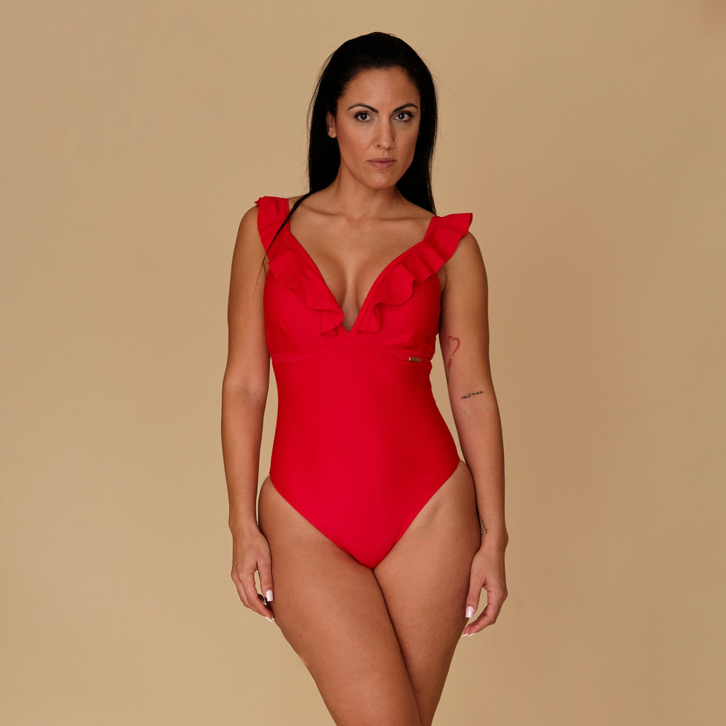 Woman wearing a maternity red swimsuit, made with sustainable fabrics, made in Spain