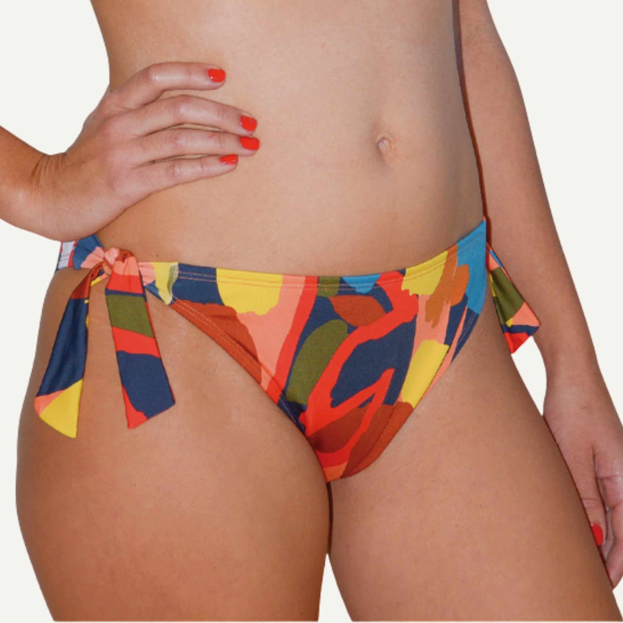 Colorful bikini bottom with abstract pattern on a white background